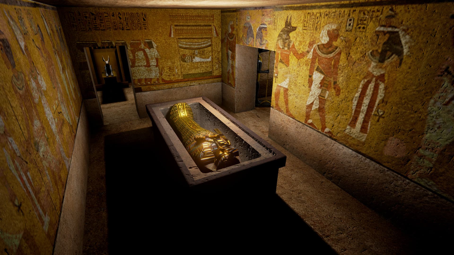 Inside the reconstructed burial chamber of King Tutankhamun: the gilded sarcophagus sunk into a stone plinth, surrounded by wall paintings and hieroglyphs